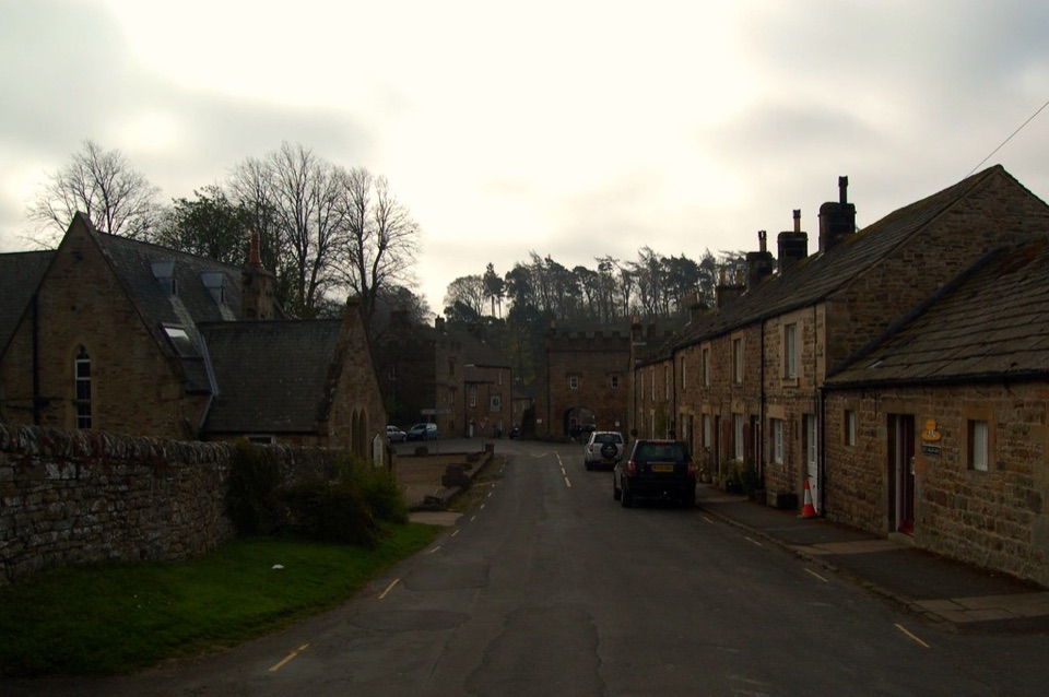 A stone terrace of houses along the village street at Blanchland in Northumberland
