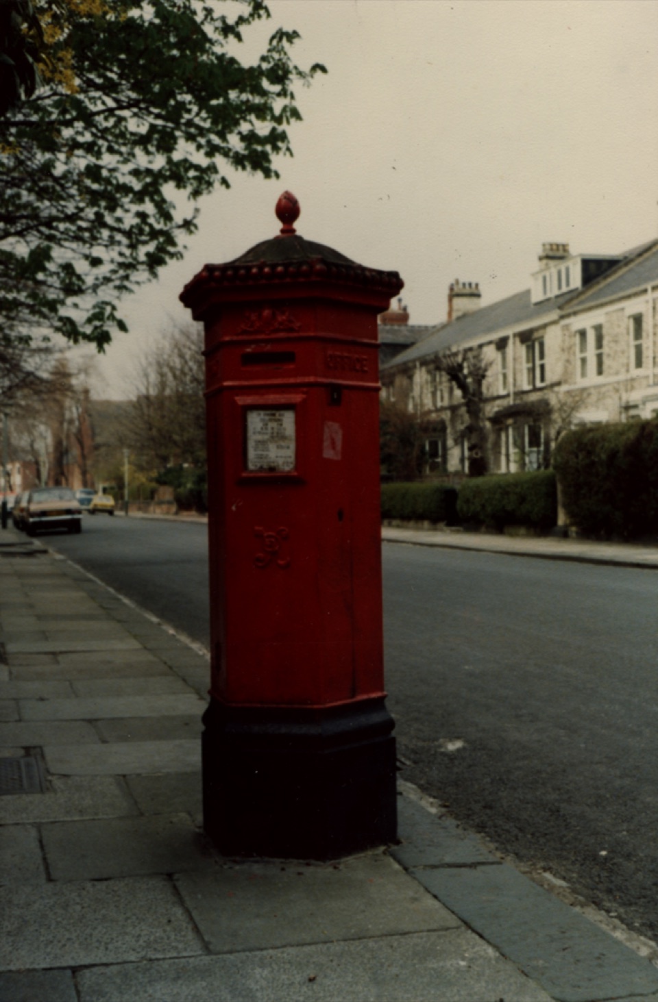 A pillar box on the pavement of a Victorian terrace street in Jesmond, Newcastle